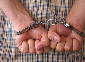 Hands in handcuffs