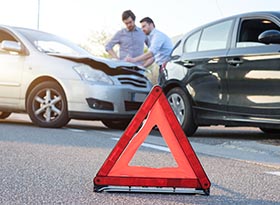 Two men reporting a car crash for the insurance claim