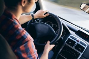 young man behind the wheel